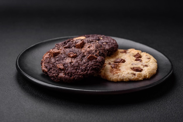 Delicious fresh crispy oatmeal cookies with chocolate and nuts