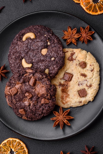 Delicious fresh crispy oatmeal cookies with chocolate and nuts