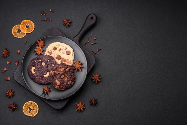 Delicious fresh crispy oatmeal cookies with chocolate and nuts