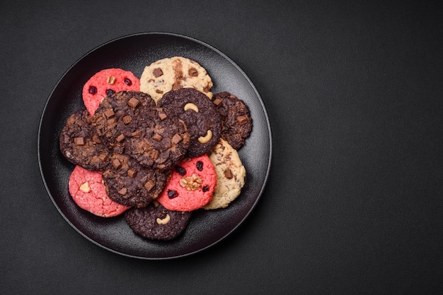 Delicious fresh crispy oatmeal cookies with chocolate and nuts