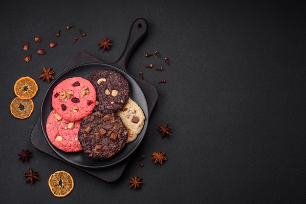 Delicious fresh crispy oatmeal cookies with chocolate and nuts