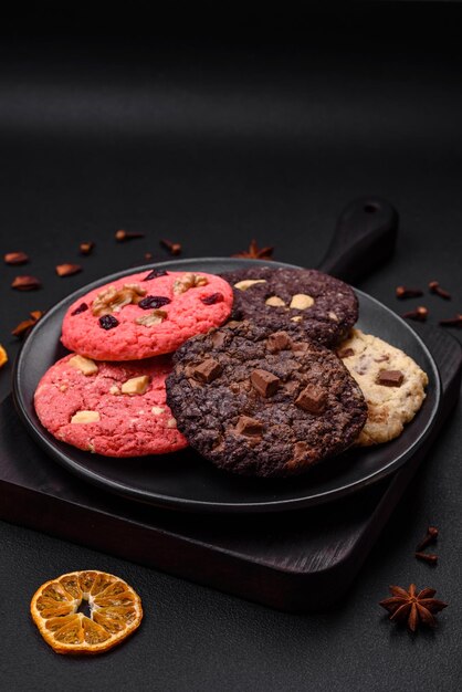 Delicious fresh crispy oatmeal cookies with chocolate and nuts