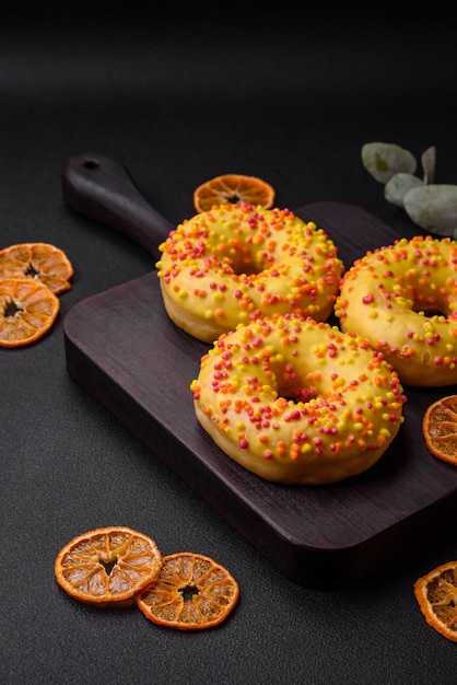 Delicious fresh donuts in yellow glaze with lemon flavor filling