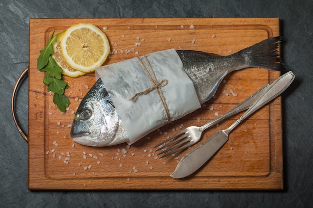 Delicious fresh dorado on chopping board