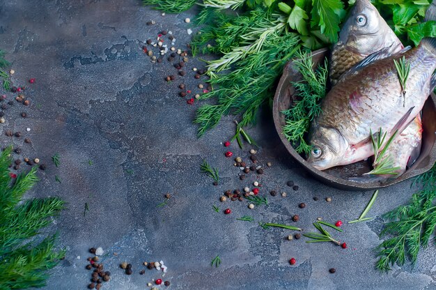 Delicious fresh fish on dark vintage background.