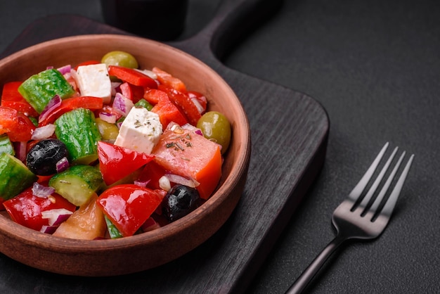 Delicious fresh Greek salad with feta cheese olives tomatoes and cucumbers