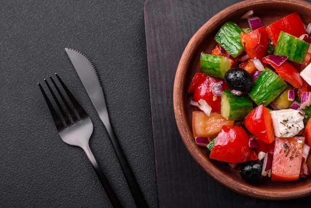 Delicious fresh Greek salad with feta cheese olives tomatoes and cucumbers