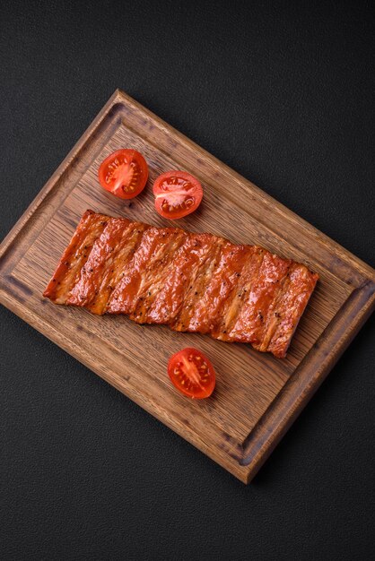 Delicious fresh grilled or smoked ribs with salt spices and herbs