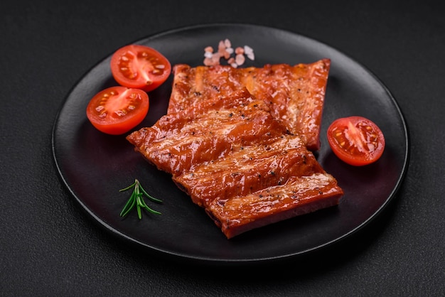 Delicious fresh grilled or smoked ribs with salt spices and herbs