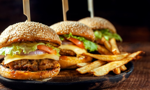 Delicious fresh homemade burger on wooden plate