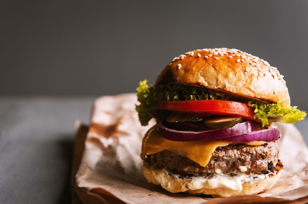 Delicious fresh homemade burger on a wooden table