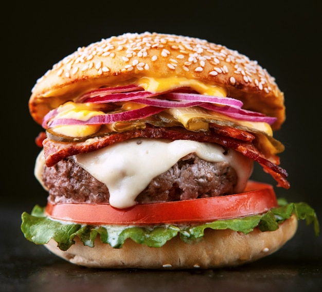 Delicious fresh homemade burger on a wooden table