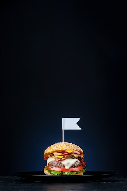 Delicious fresh homemade burger on a wooden table