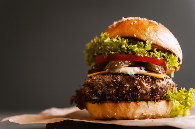 Delicious fresh homemade burger on a wooden table