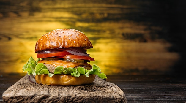 Delicious fresh homemade burger on a wooden table