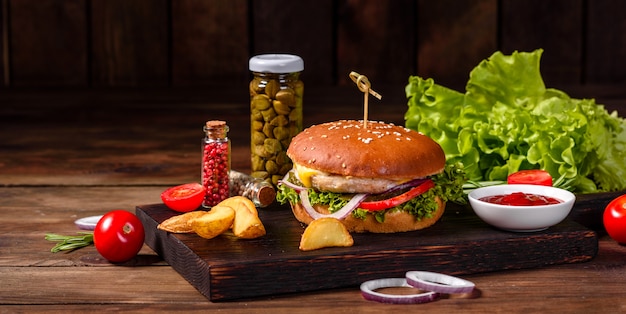 Delicious fresh homemade burger on a wooden table