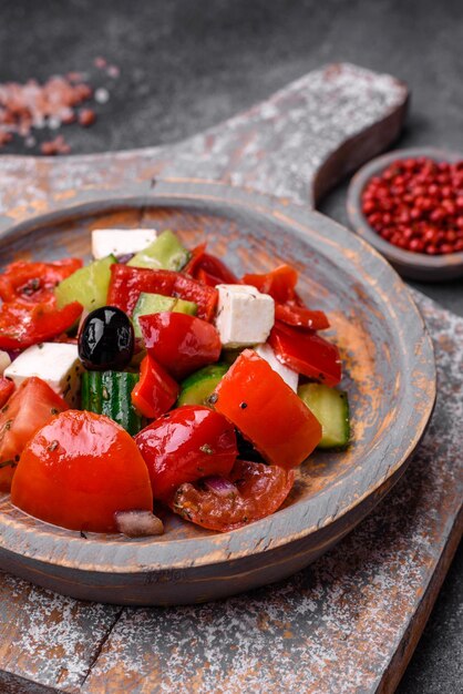 Delicious fresh juicy greek salad with feta cheese olives peppers and tomatoes