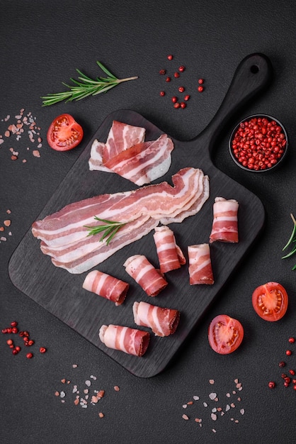 Delicious fresh pancetta with salt and spices cut into thin slices