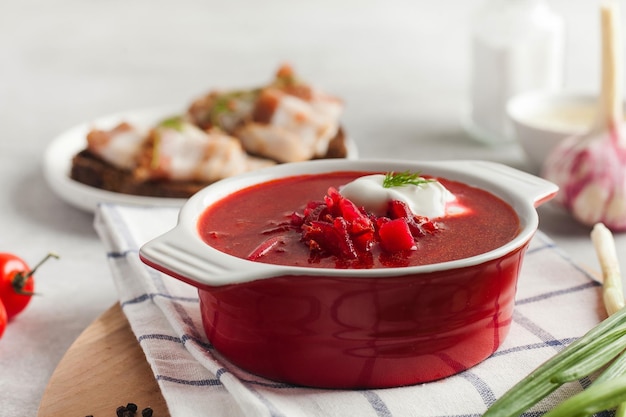 Delicious fresh red borscht dark bread with lard and salt n kitchen table