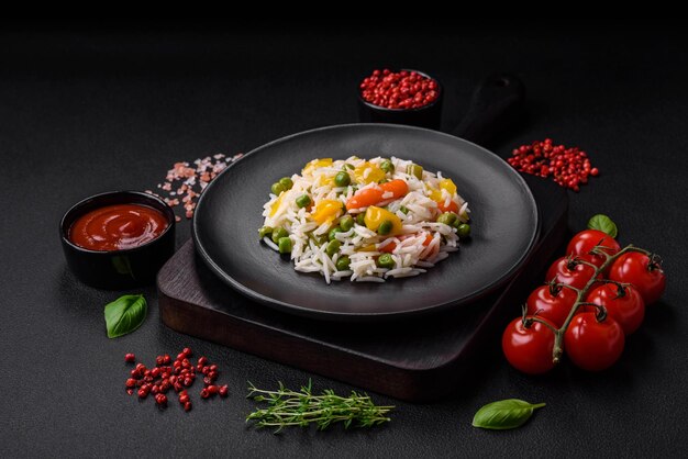 Delicious fresh white boiled rice with vegetables carrots peppers and asparagus beans on a ceramic plate