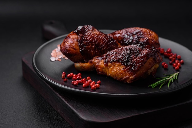 Delicious grilled chicken legs with spices and herbs in teriyaki sauce