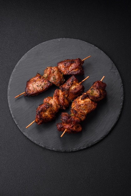 Delicious grilled chicken turkey or pork skewers with salt spices and herbs