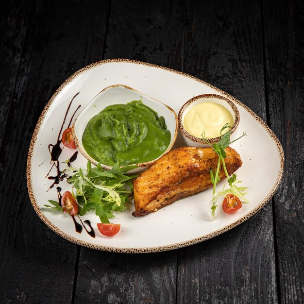 delicious grilled salmon in the restaurant. On a dark background