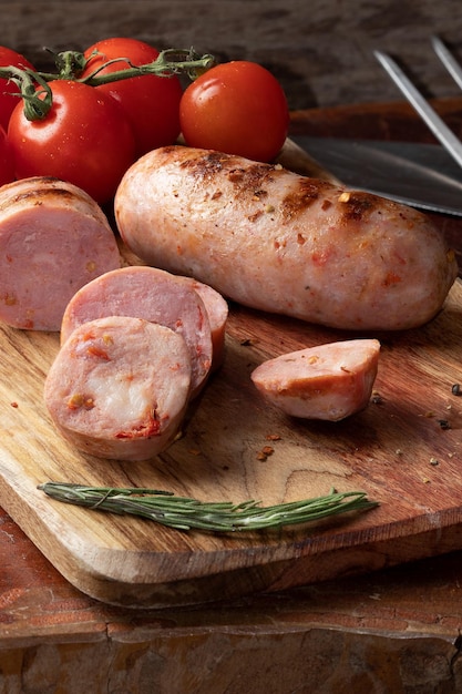 Delicious grilled sausage on cutting board