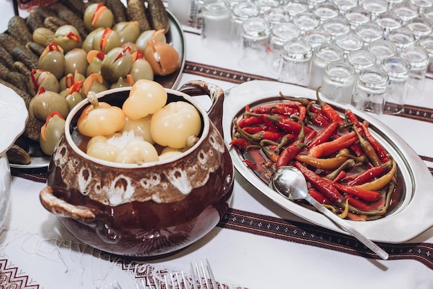 Delicious healthy food at wedding reception venue stuffed tomatoes pickles and peppers on traditional reception vegetables at party dinner concept