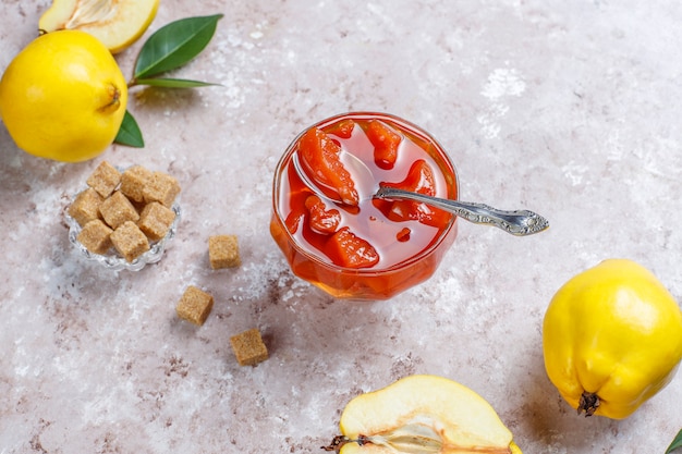 Delicious and healthy homemade quince jam in glass,top view