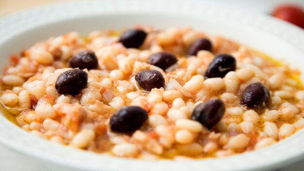 Delicious and healthy white bean salad with cod and black olives