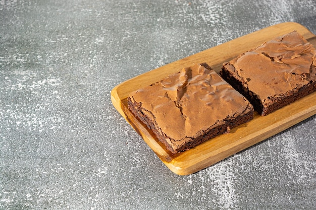 delicious homemade brownie over table with text area