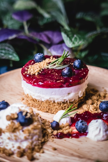 Delicious homemade cheesecake with berry sauce.