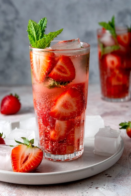 Delicious homemade drinks. Strawberry cocktails with fresh strawberries and mint leaves