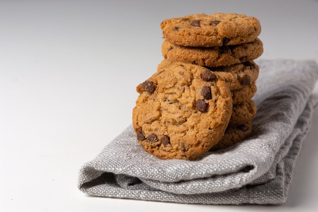 Delicious homemade and freshly baked cookies over white table isolated background