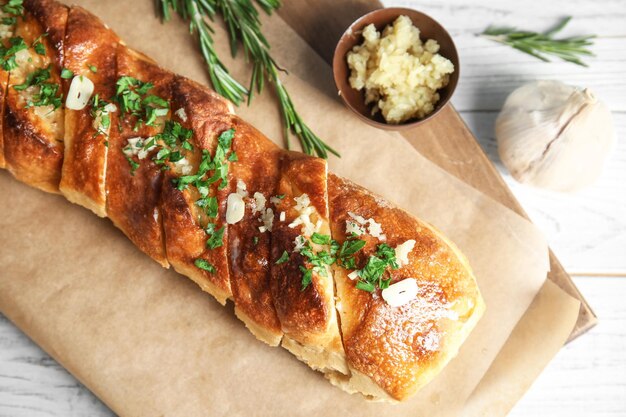 Delicious homemade garlic bread on table top view