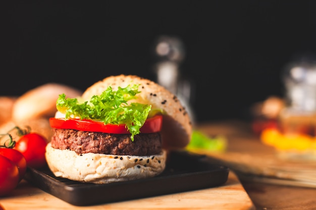 Delicious homemade hamburger with fresh vegetables in the kitchen 