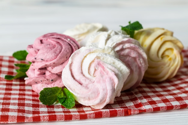 Delicious homemade marshmallows with different berries and vanilla flavors and pink, white, yellow colors