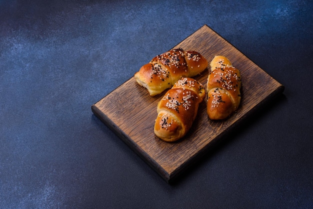 Delicious homemade pastries with apricot jam sprinkled with sesame seeds