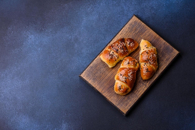 Delicious homemade pastries with apricot jam sprinkled with sesame seeds