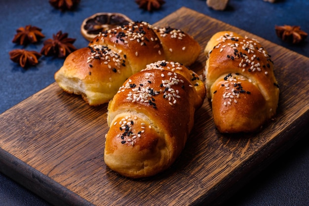 Delicious homemade pastries with apricot jam sprinkled with sesame seeds