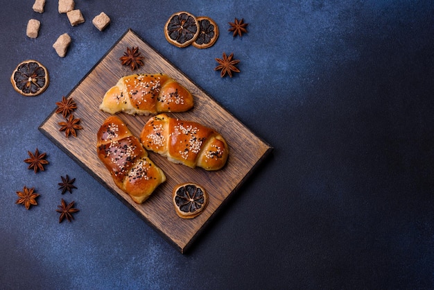 Delicious homemade pastries with apricot jam sprinkled with sesame seeds