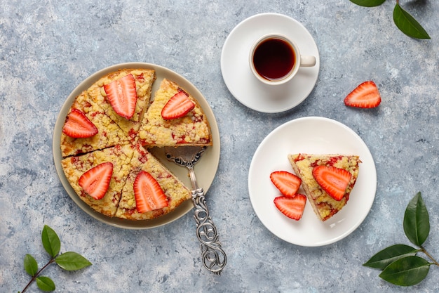 Delicious homemade strawberry crumble cake with fresh strawberry slices,top view