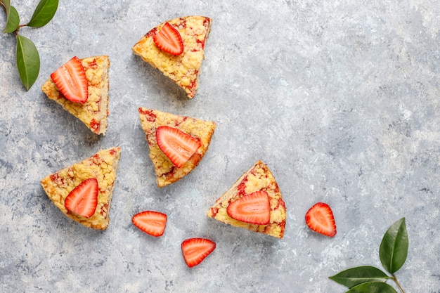 Delicious homemade strawberry crumble cake with fresh strawberry slices,top view