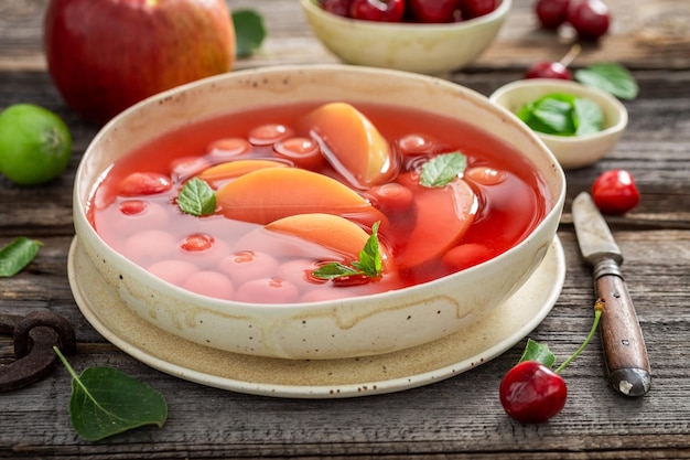 Delicious and hot fruit soup made of cherries and apples Homegrown fruit harvested in the summer