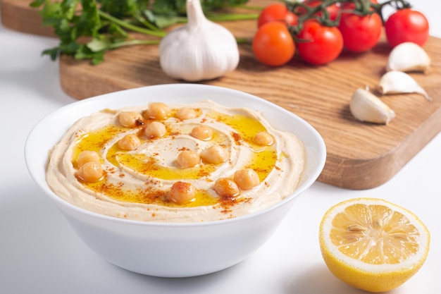 Delicious hummus with chickpeas olive oil lemon and pita bread Vegetarian food concept