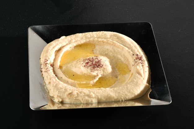 Delicious hummus with chickpeas, olive oil, lemon and .Vegetarian food concept.