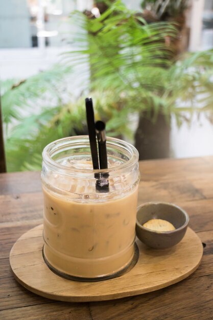 Delicious iced coffee with cookie