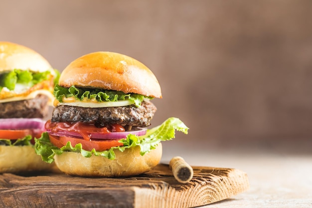 Delicious juicy grilled burger on wheat buns Studio macro shotFood Feast Party