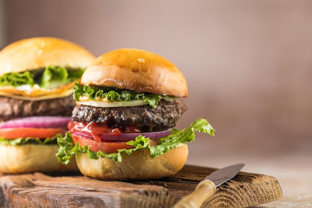 Delicious juicy grilled burger on wheat buns Studio macro shotFood Feast Party